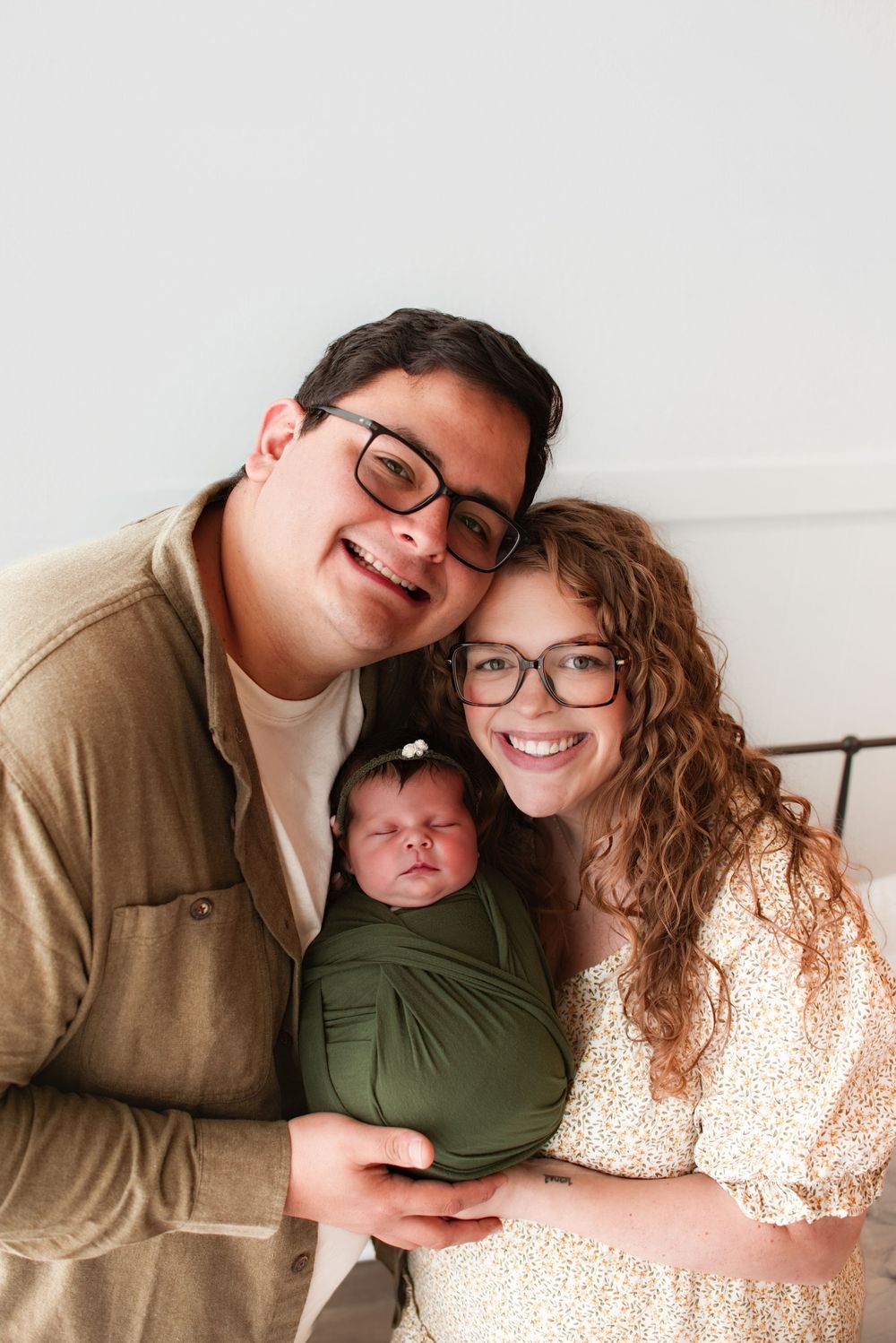 Lifestyle family photography session with modern minimalist white background.