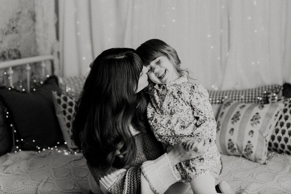 A black and white photo collage shows intimate wedding moments with floral bouquets and romantic poses.