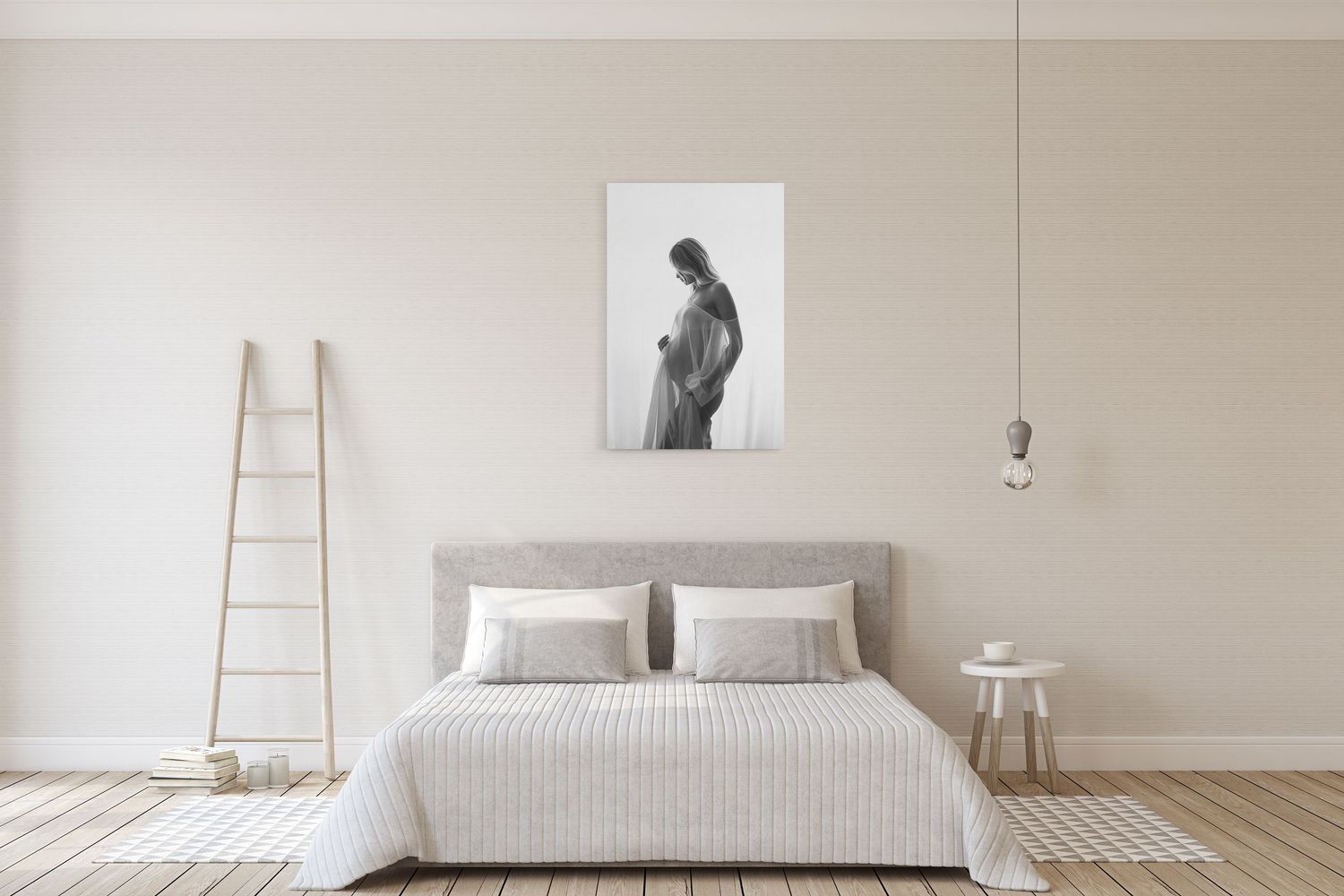 Minimalist bedroom interior with white bedding, beige walls, and a decorative wooden ladder against the wall.