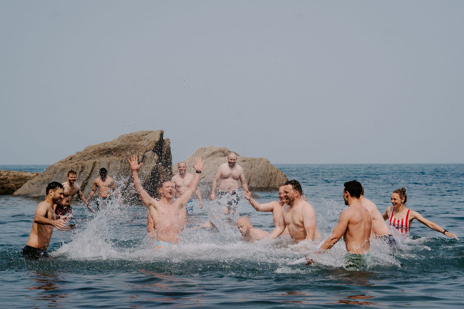 Groomsmen on morning of the wedding at tunnels beach wedding venue in north Devon, going for a morning swim in the sea