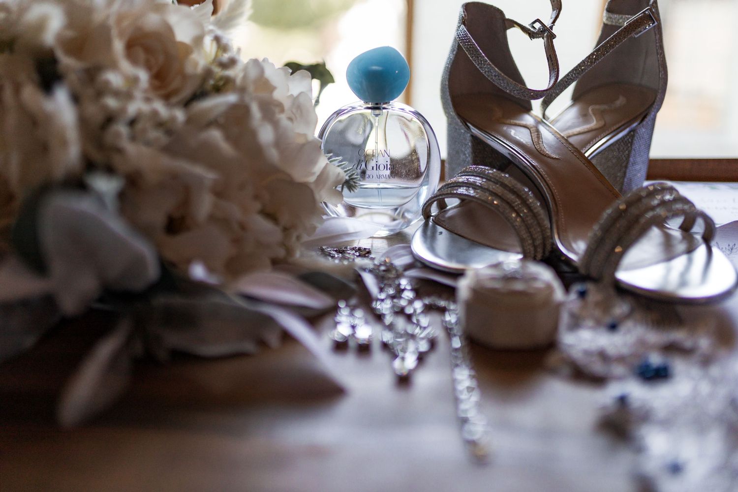 Wedding detail shots of jewelry and accessories with soft focus.