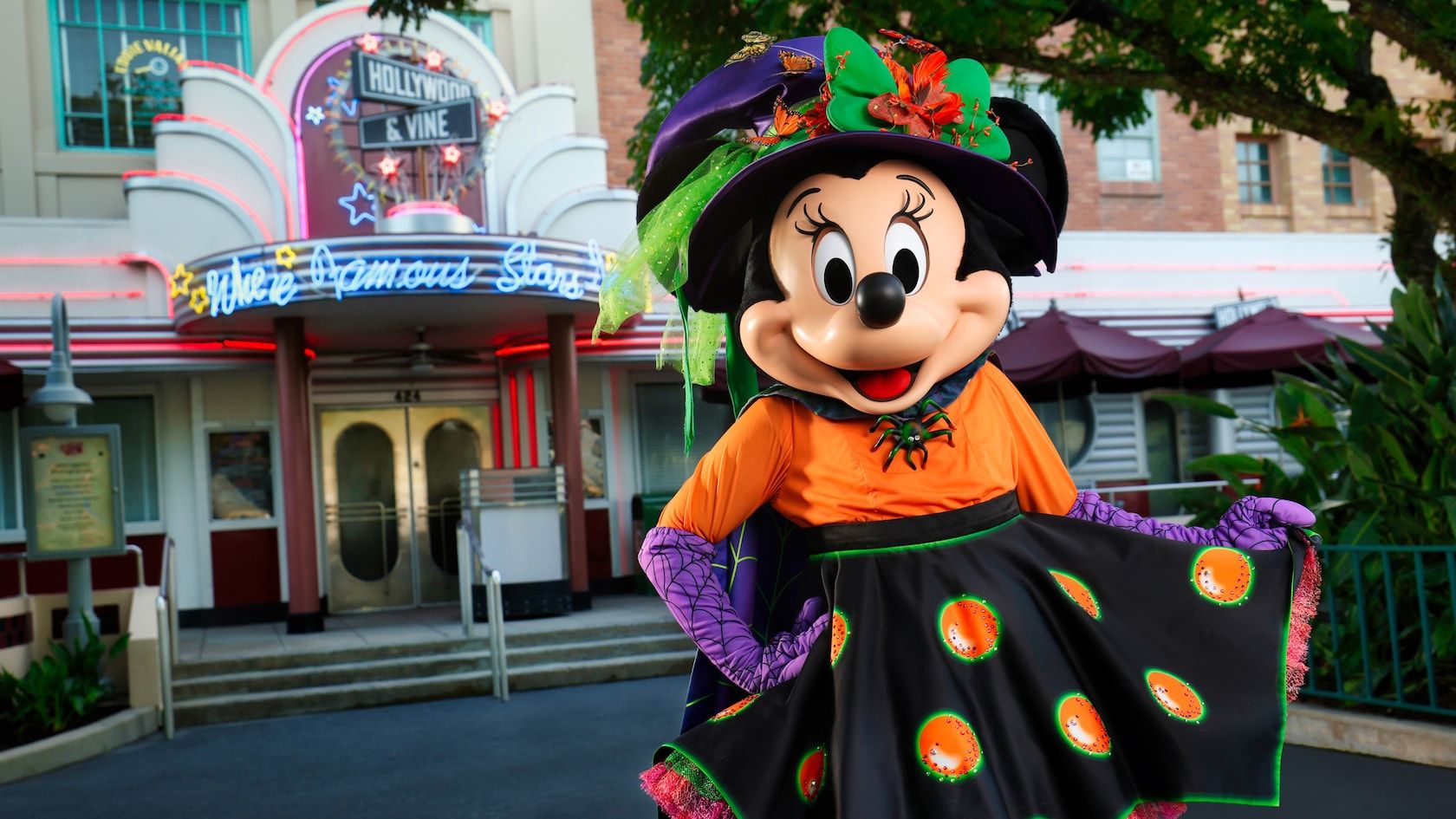 Halloween-themed decorative lights and displays line Main Street USA at Disney World's Magic Kingdom theme park.
