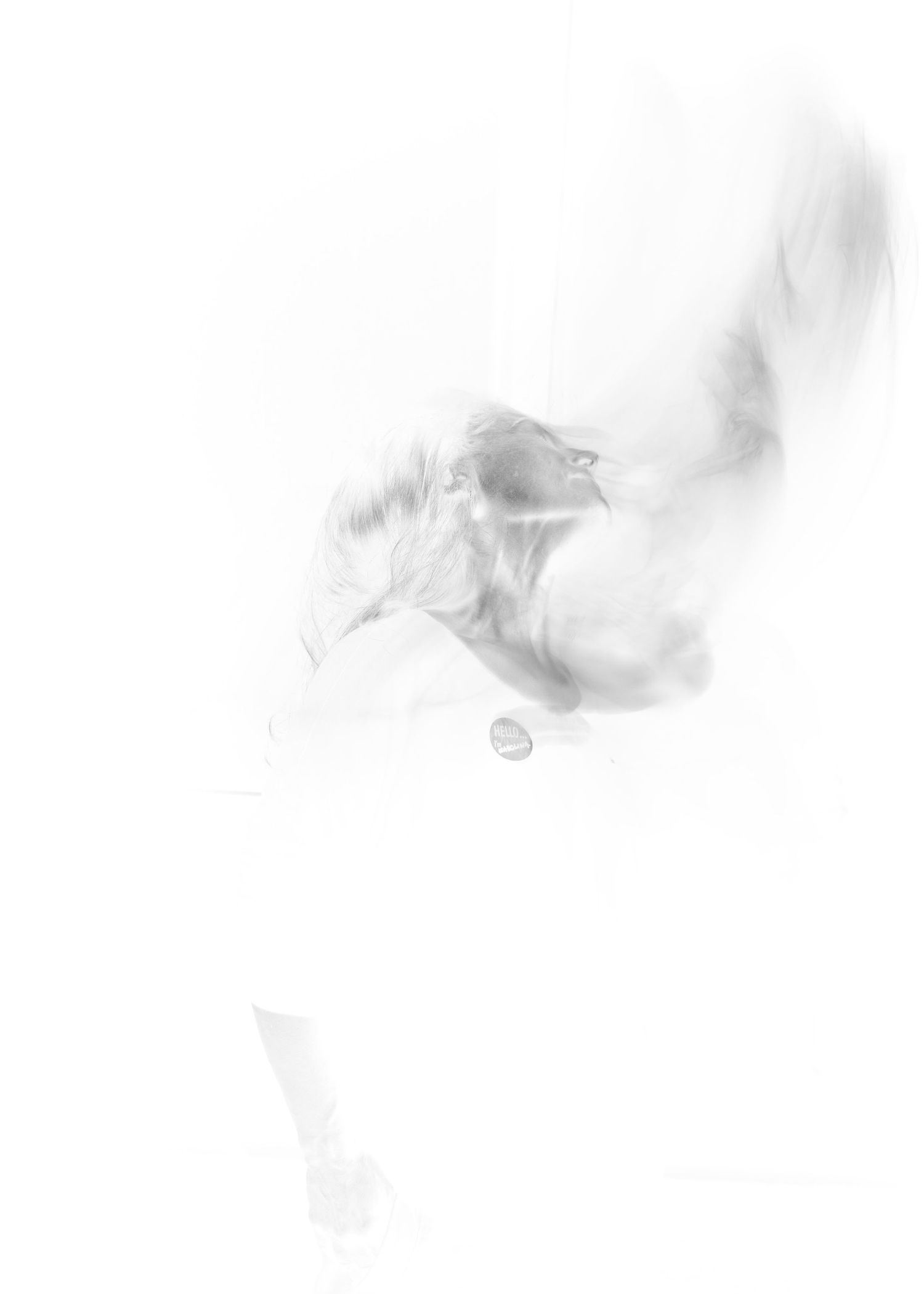 A soft and ethereal plume of white smoke curls gracefully against a light background creating a delicate abstract pattern.