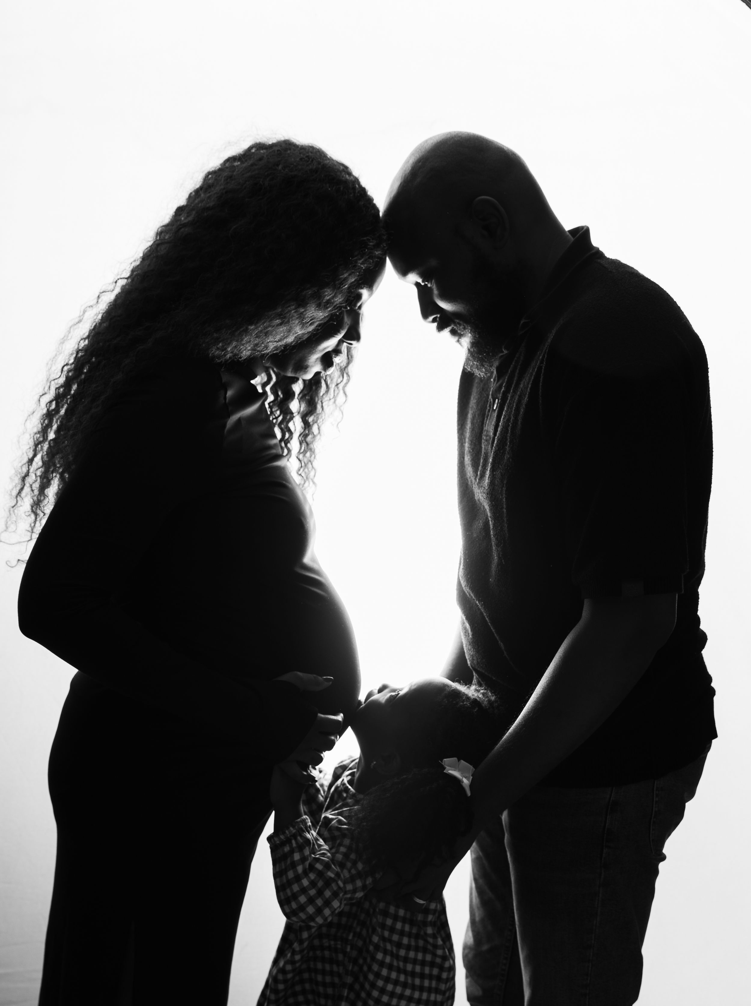 Black and white silhouettes of people in a row show diverse poses and expressions against a white background.