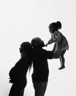 A series of black and white silhouettes showing playful movement and interaction between two figures.