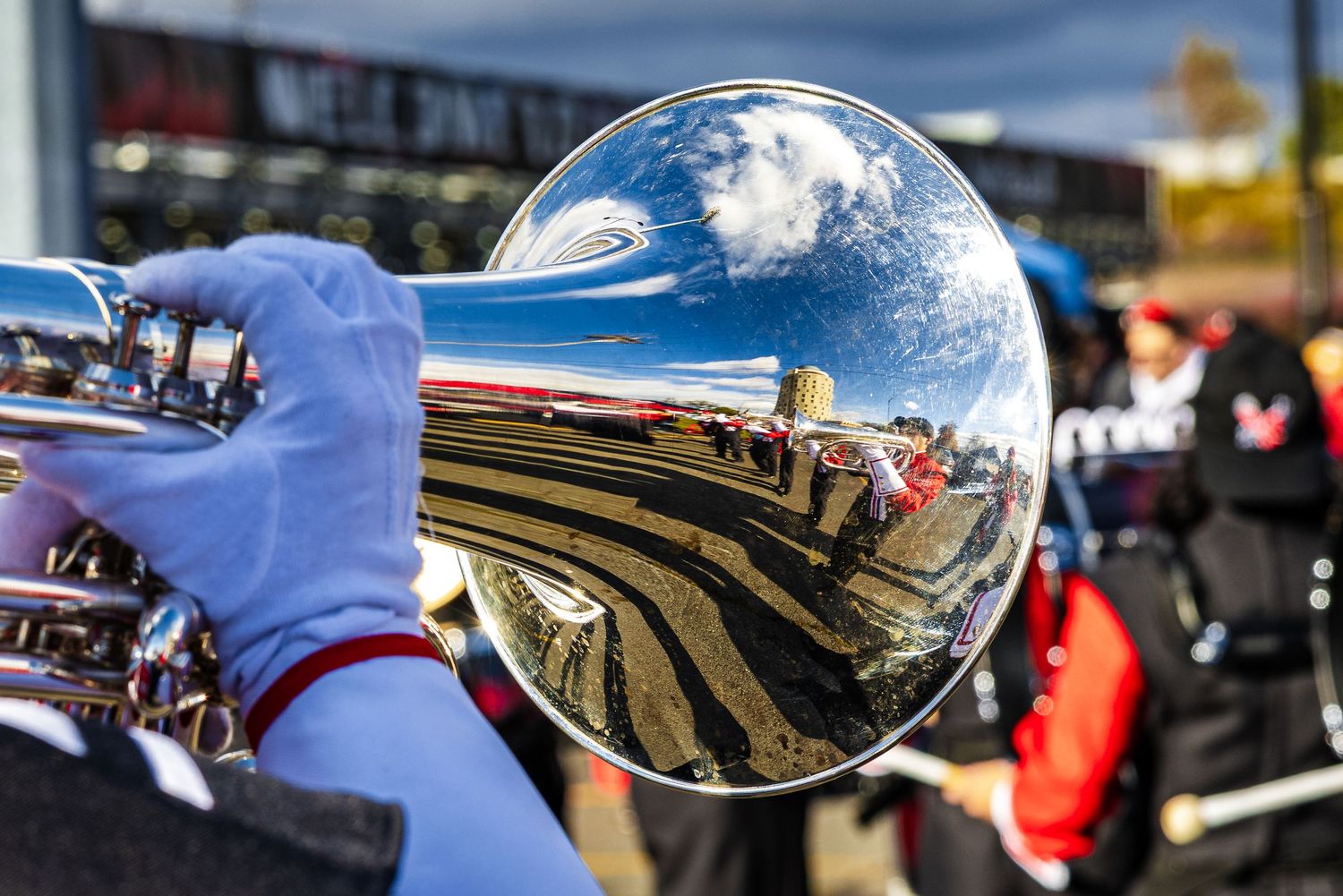 A trumpt player showing a reflection in the brass