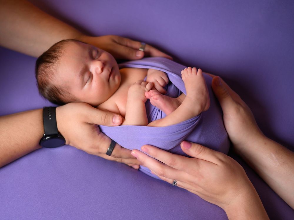 A sequence of hands performing CPR chest compressions on a medical training dummy against a purple background.