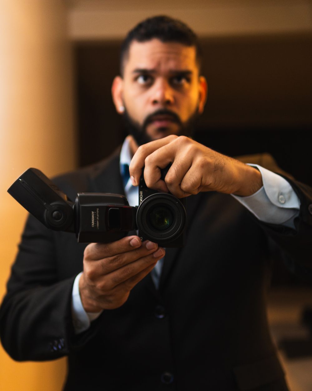 Photographer operating a camera during a professional event.