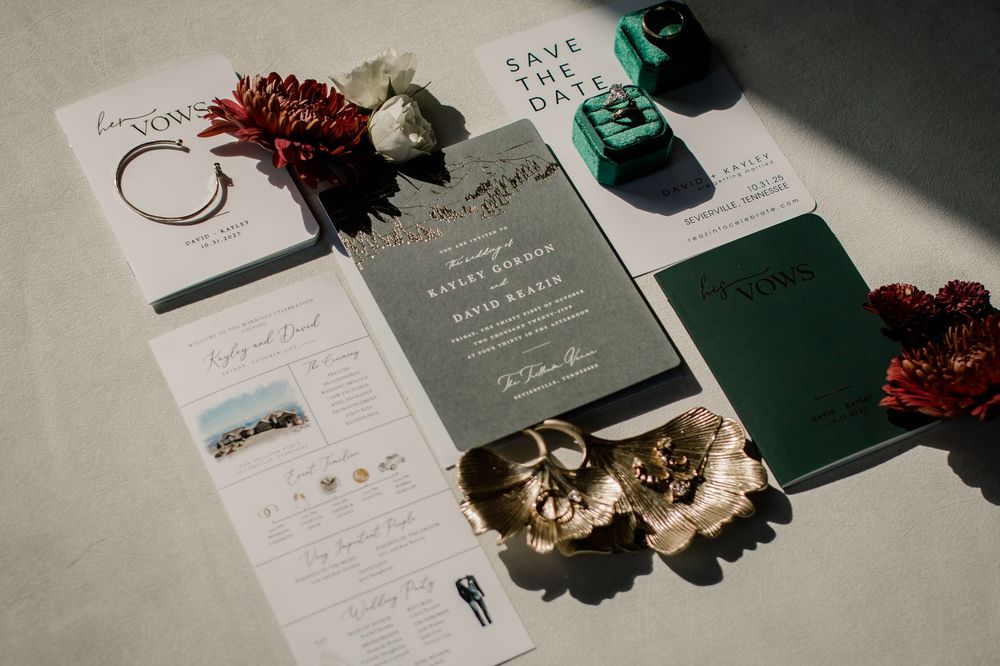 Elegant wedding stationery suite featuring dark green and burgundy accents with gold details.