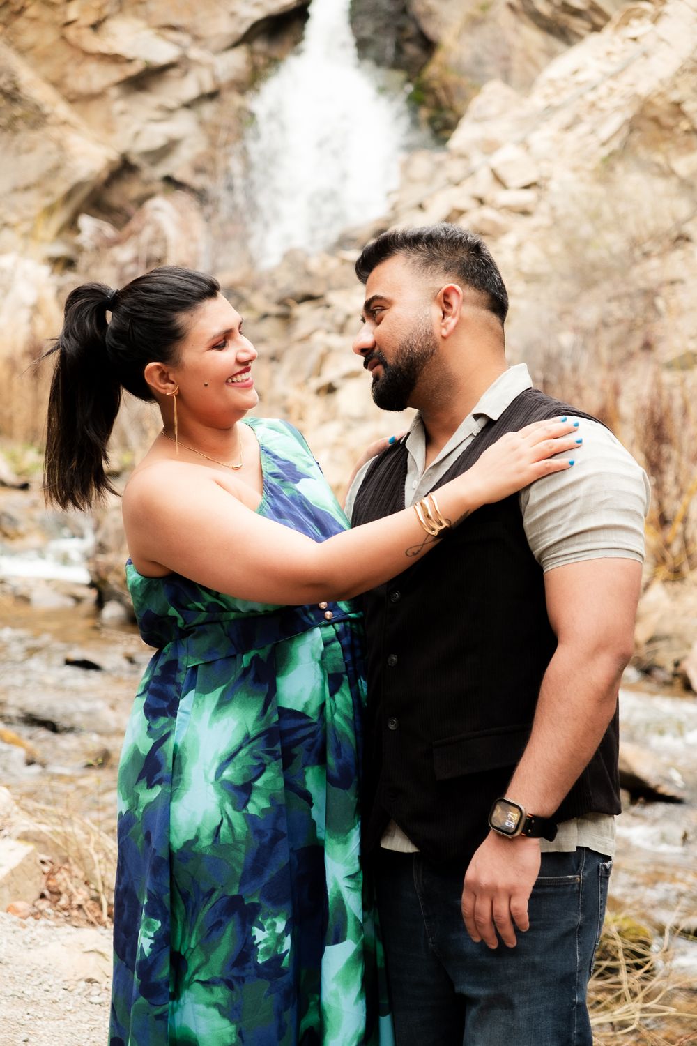 couples portrait in nature, waterfall and rock wall