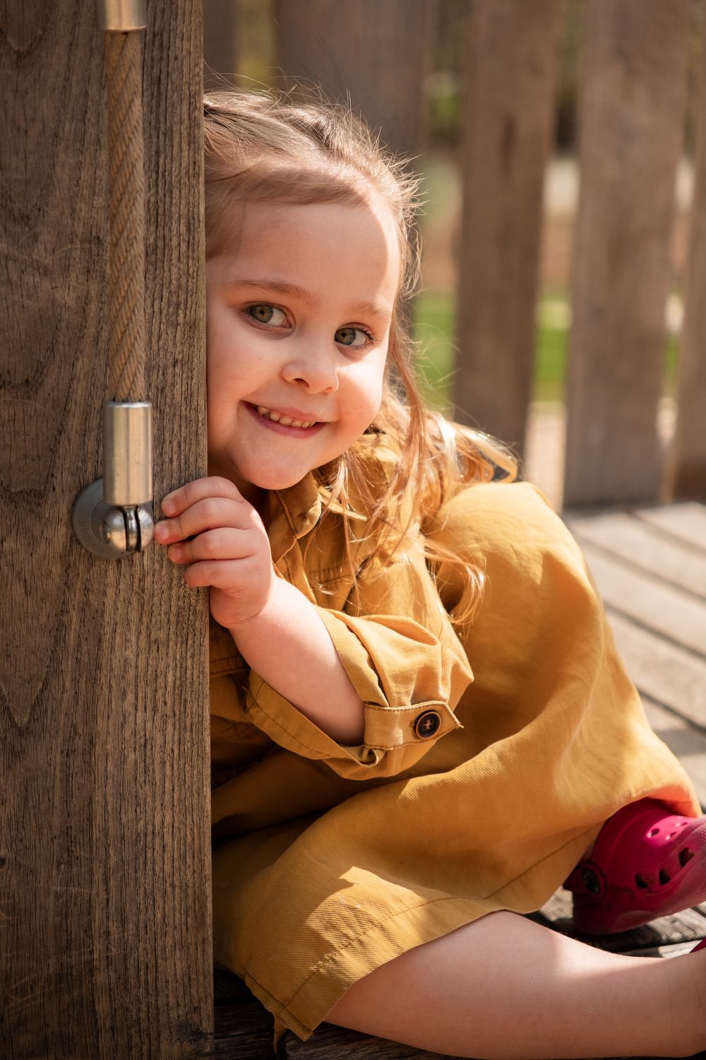 child on playground, sunny day