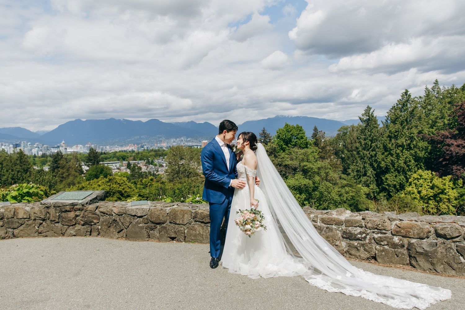 A series of wedding photos captured outdoors with scenic mountain and coastal landscapes in the background.