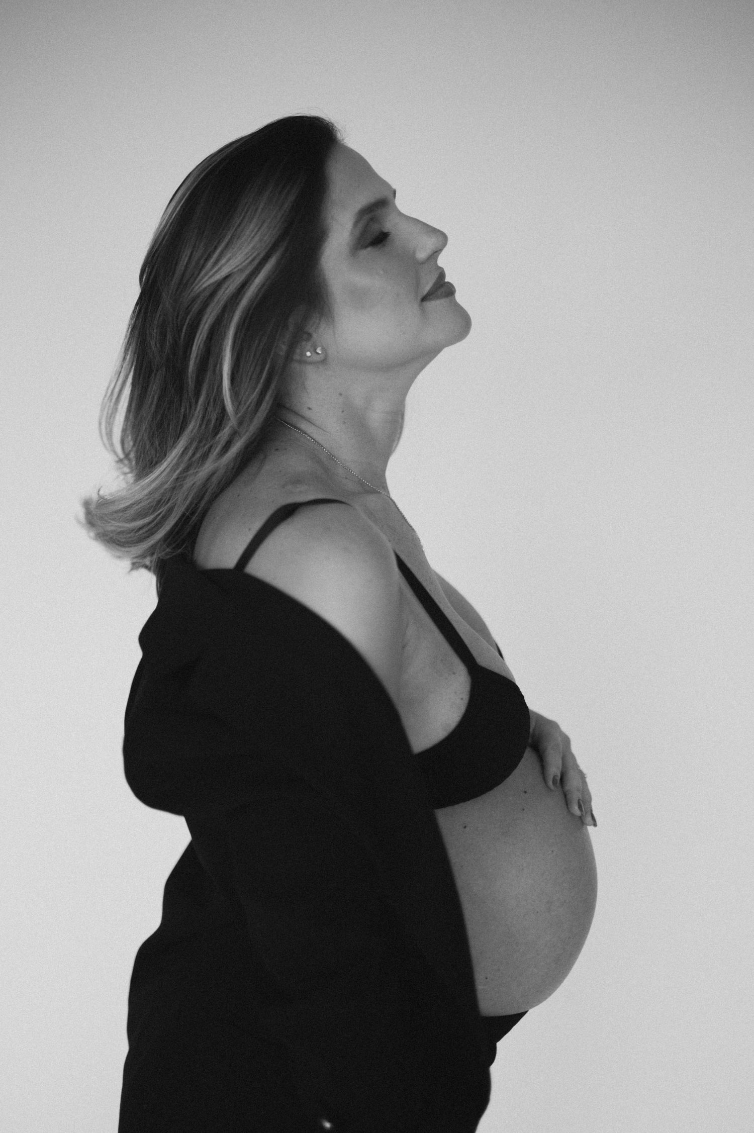 A series of black and white profile portraits showing a figure with head tilted back in an emotive artistic pose.
