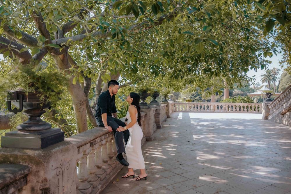 Couple showing off outfit changes during a stylish summer engagement session.