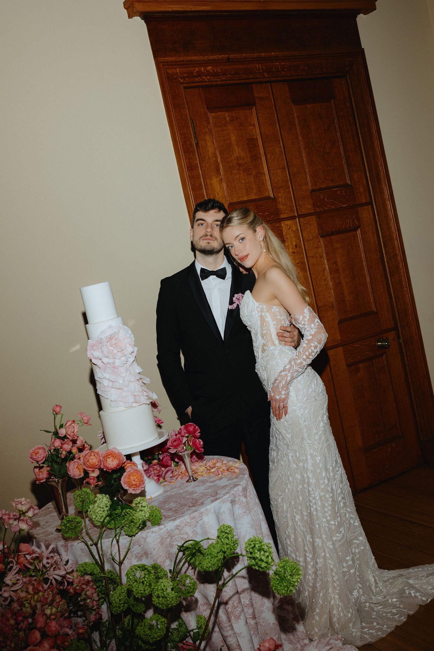 Bride and groom cutting wedding cake in Manchester
