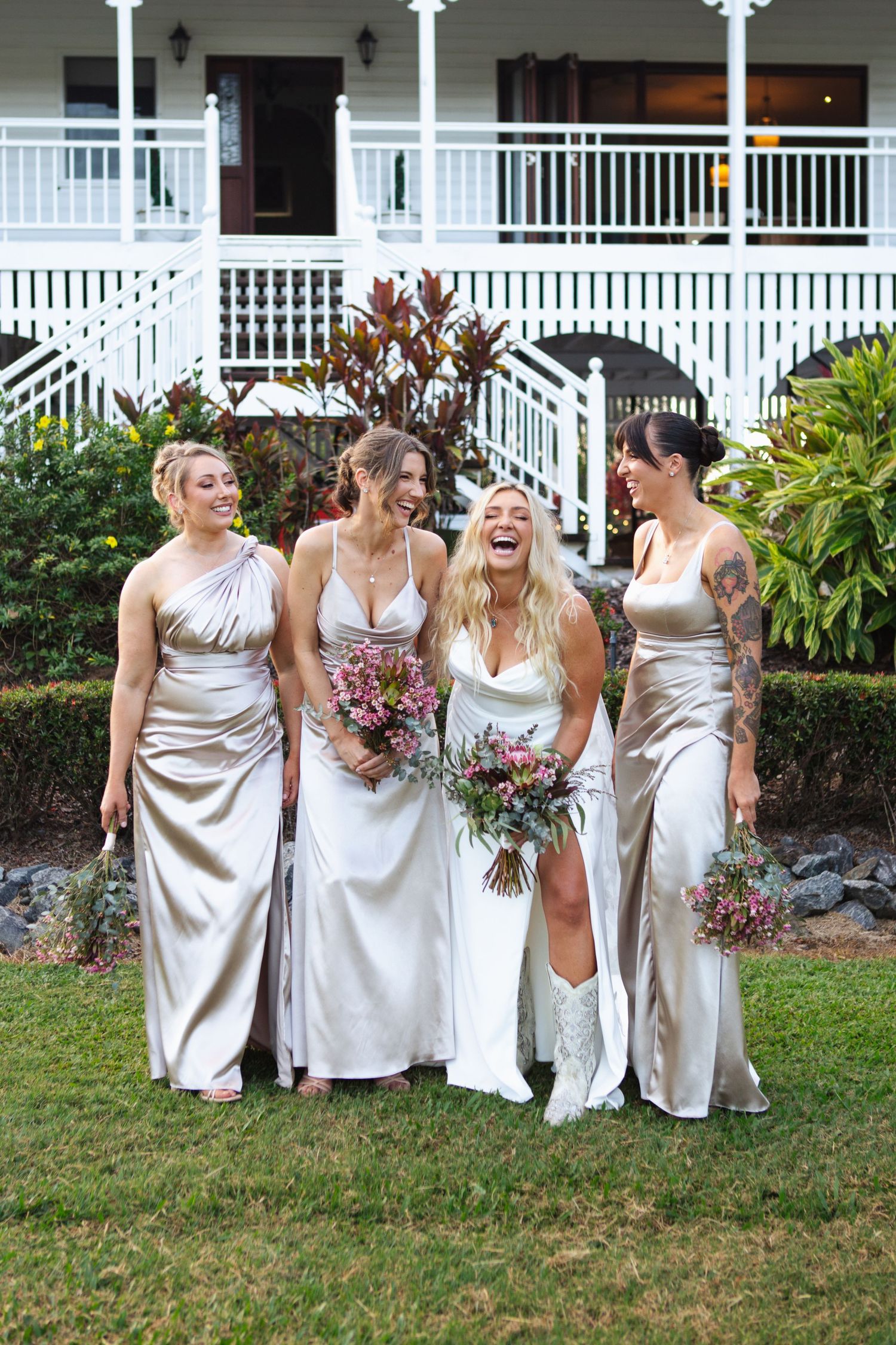 Bridesmaids and bride laughing during bridal portraits at at country Port Douglas Wedding
