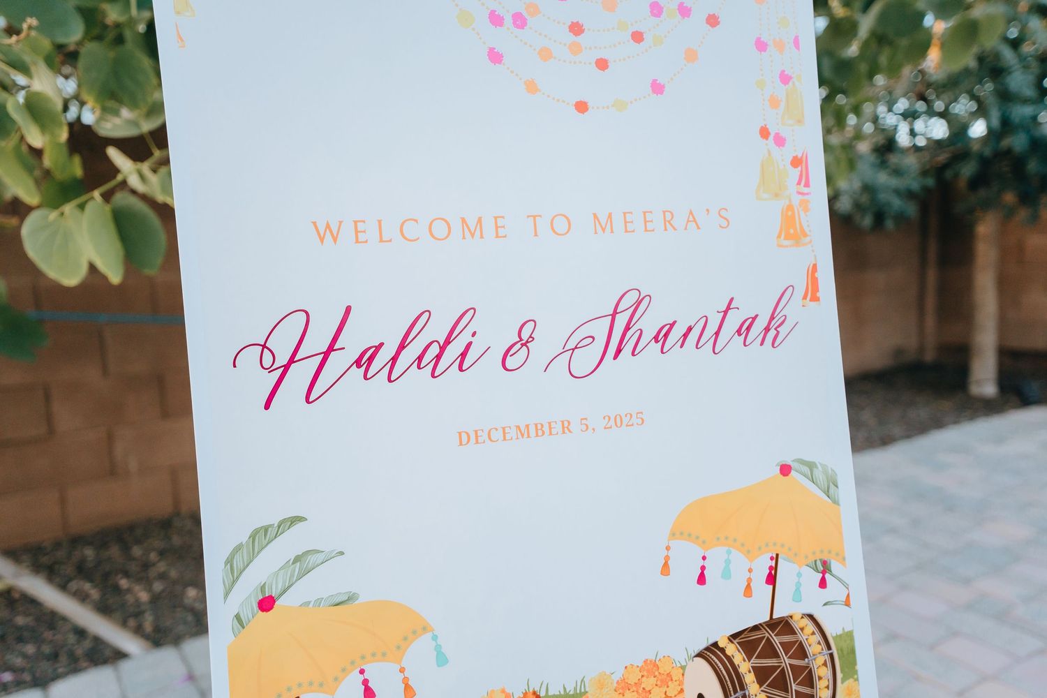 Wedding welcome signs with umbrella motifs and colorful confetti designs.