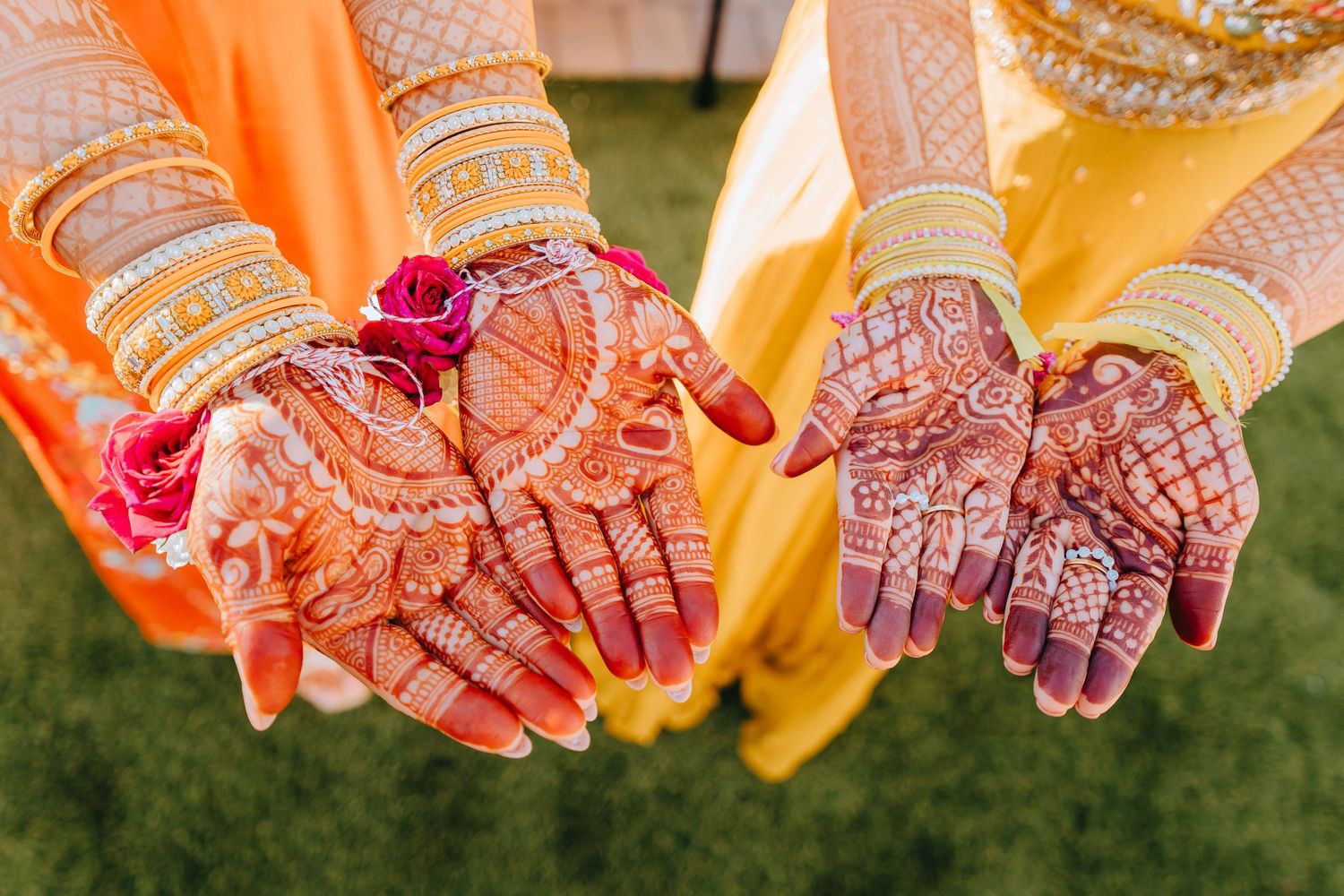 Close-up of intricate henna designs on hands decorated for an Indian wedding celebration.