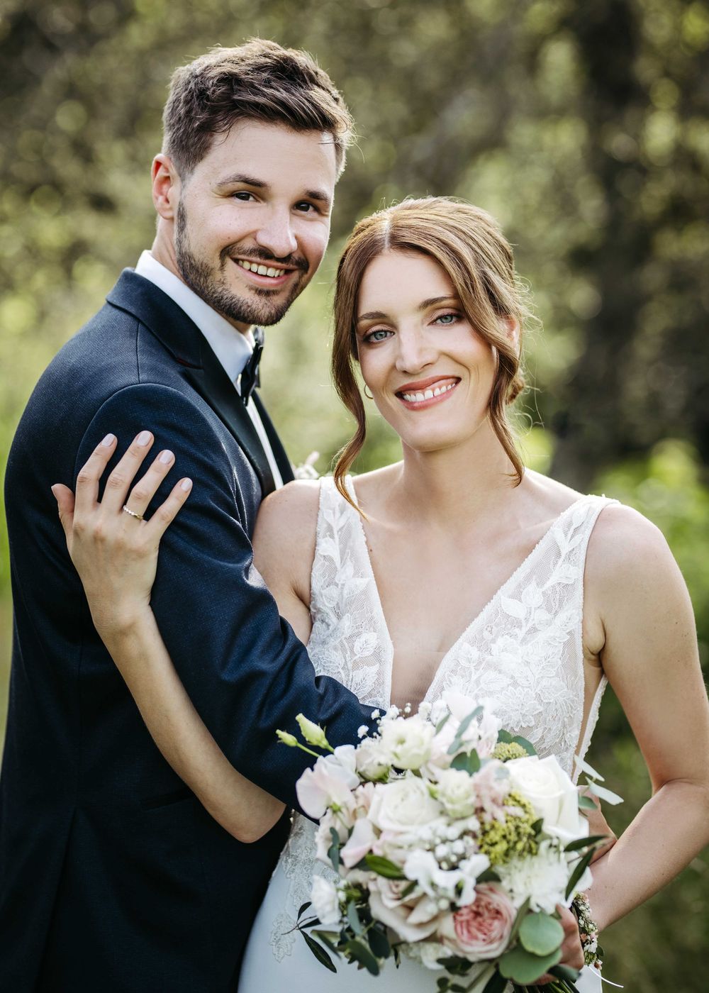 A bride and groom share intimate moments in a series of romantic outdoor wedding photos with white floral bouquet.