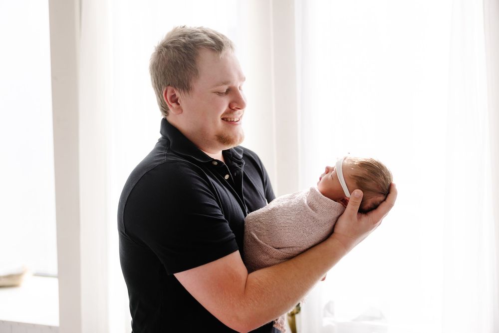 Series of candid black and white photos showing tender parent-child moments.