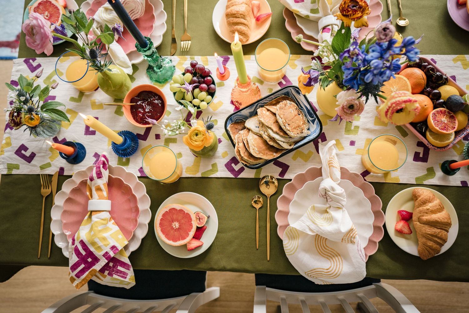 Styled brunch table flat lay with pastries fruit and flowers for food and lifestyle brand photography