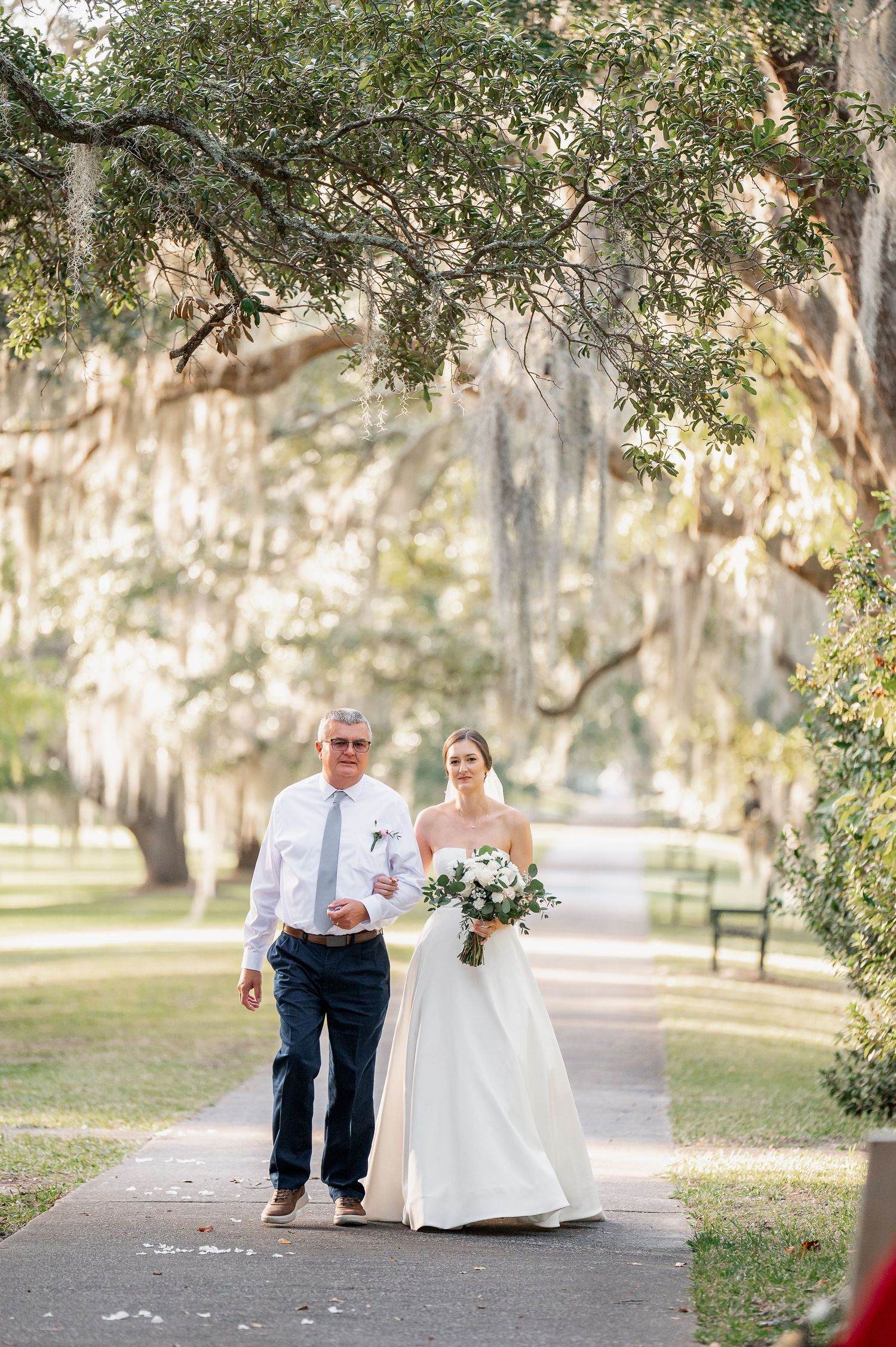 Bride walks down the aisle with father
