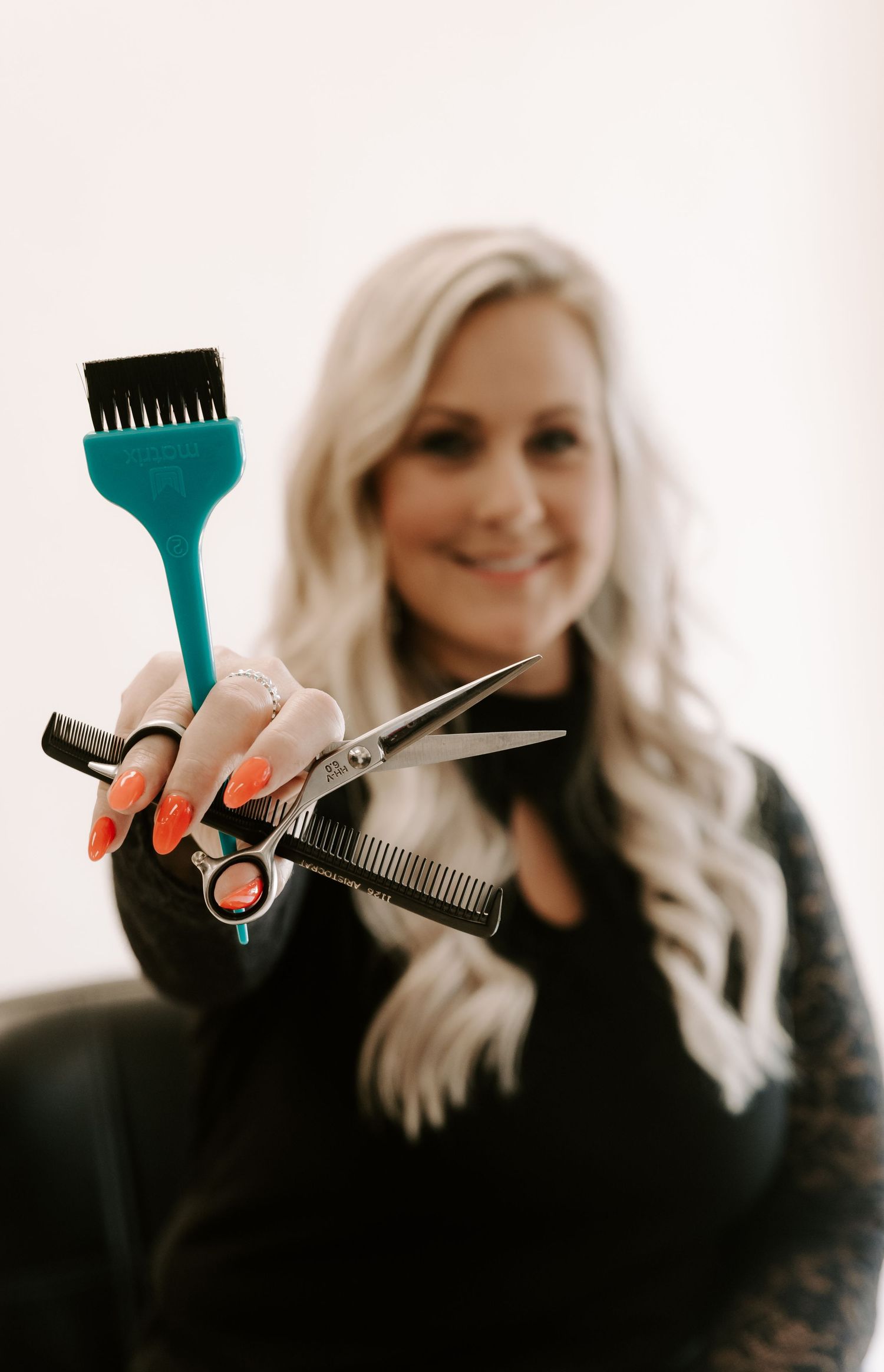 Professional hairstylist holding scissors and combs in a creative photo collage sequence.