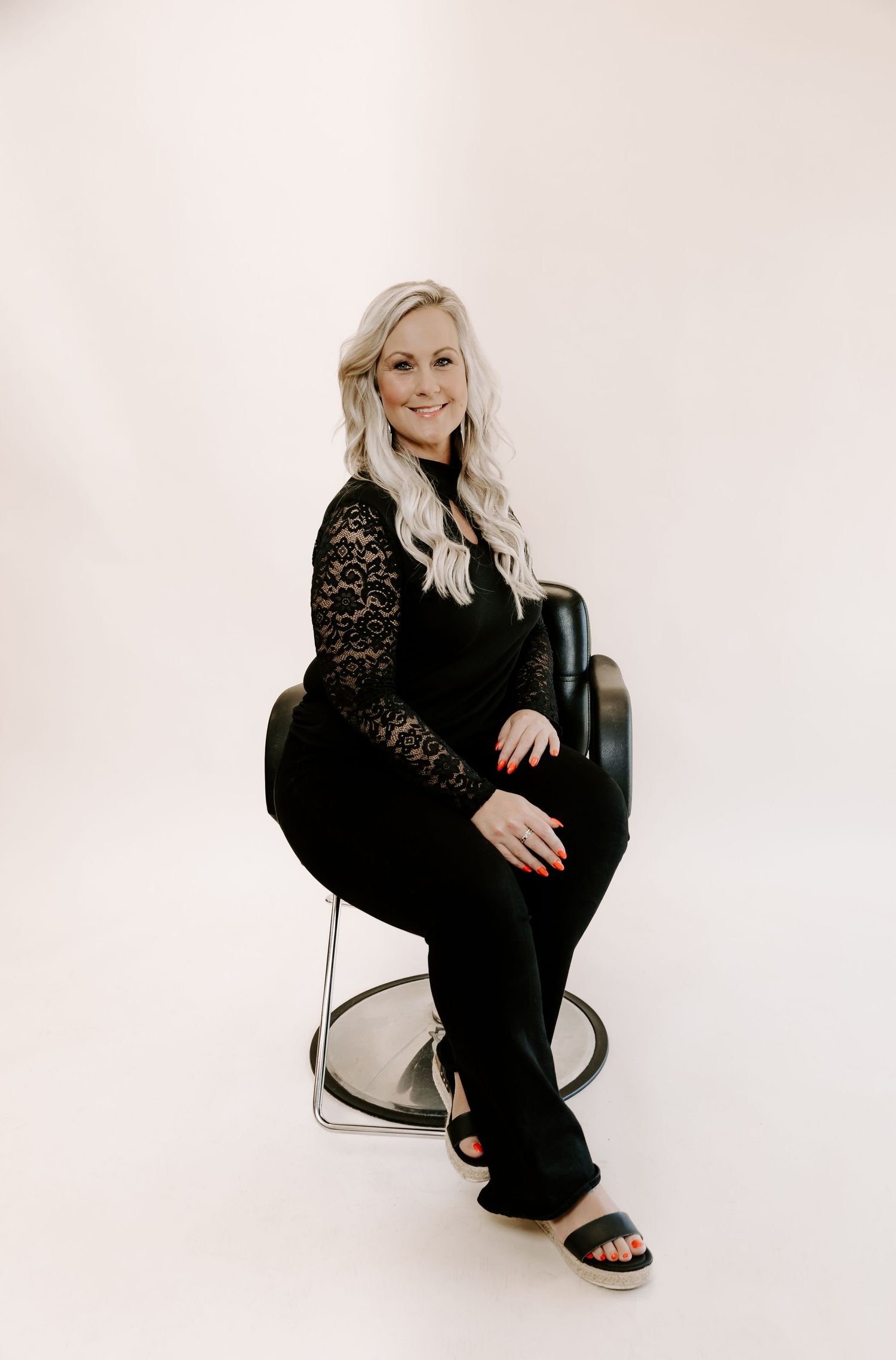 A series of fashion poses in black lace outfit against white background showing different angles and stances.