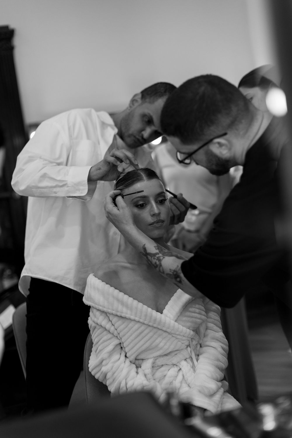 Black and white photo sequence showing an intimate couple's dance in formal attire.