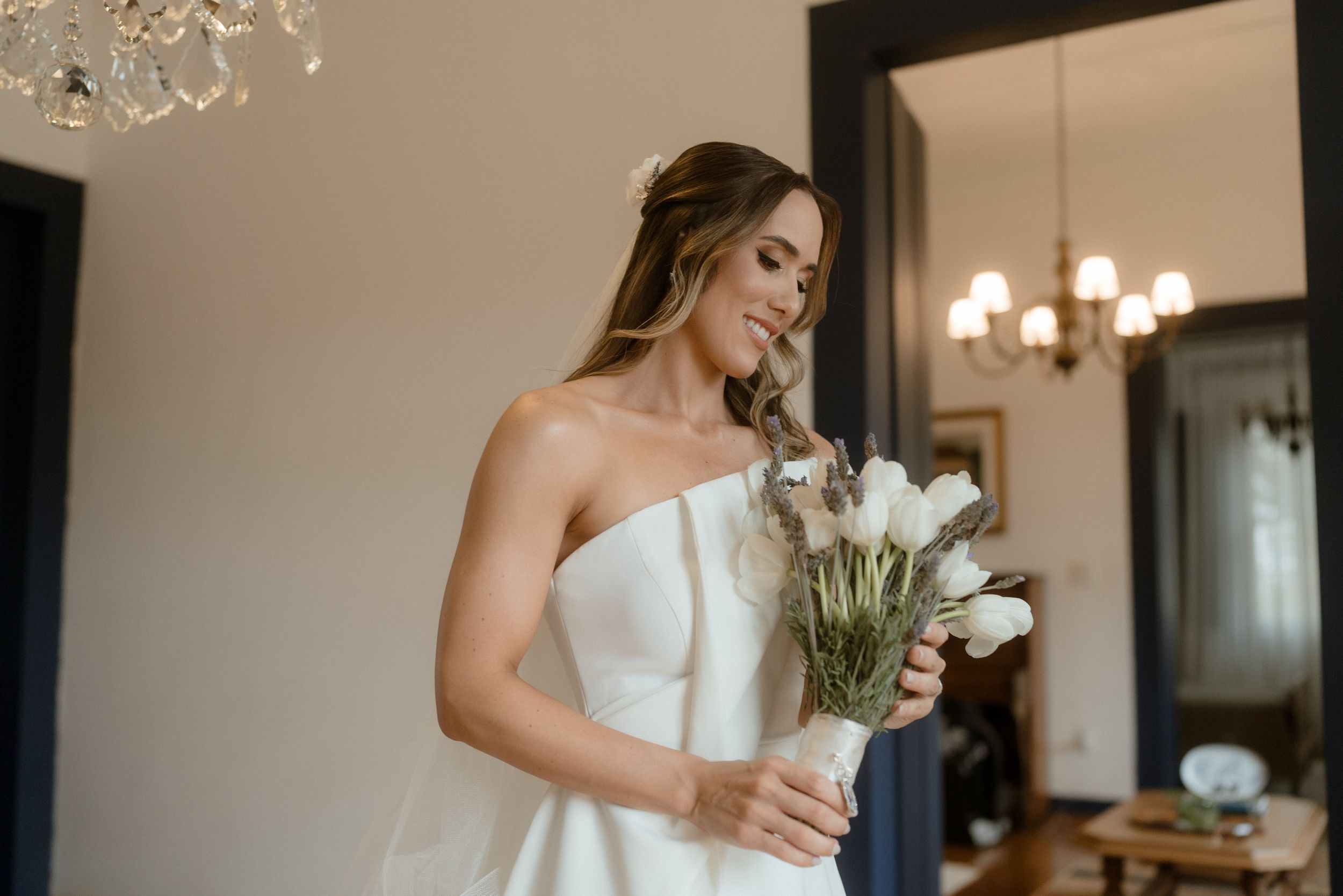 Elegant bridal portraits showcasing a modern white wedding gown in a classic interior setting.