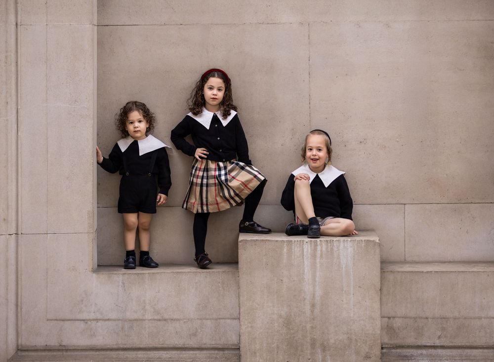 Portrait of 3 children in the city of London.
