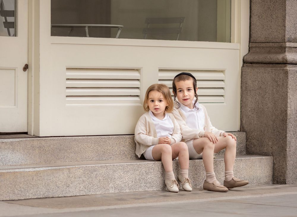 picture of 2 boys at a shopfront.