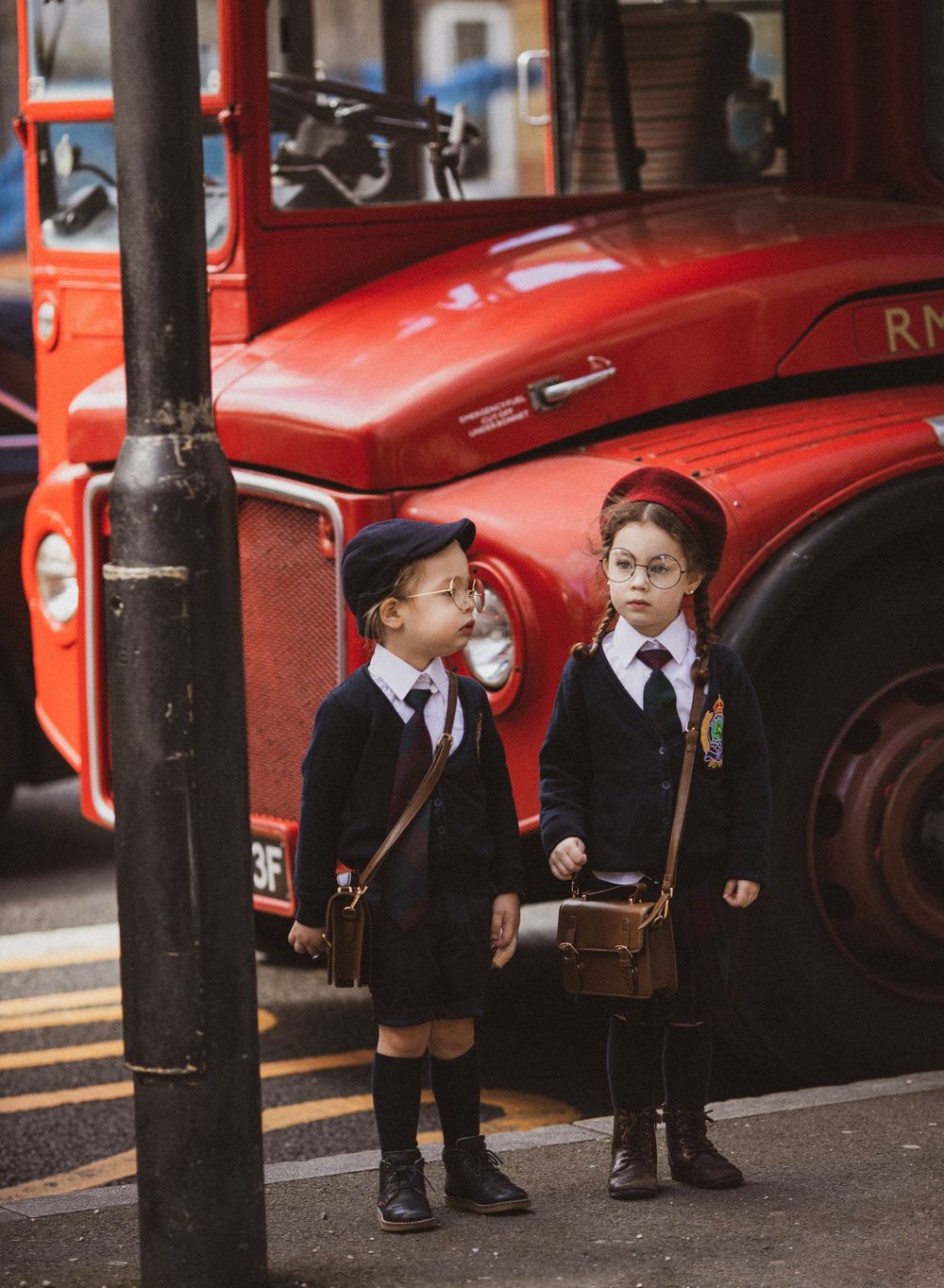 A vintage portrait of children waiting for the school bus.