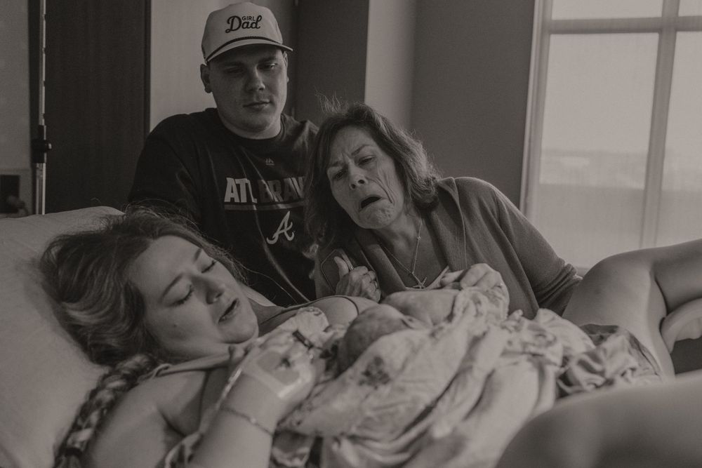 Monochrome images documenting the progression of labor and delivery in a medical setting.