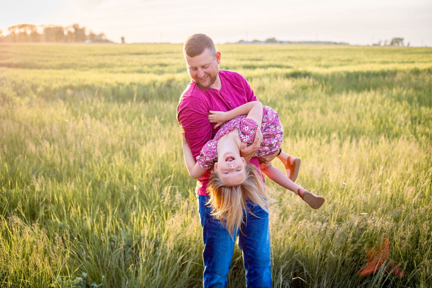 father and daughter laughing