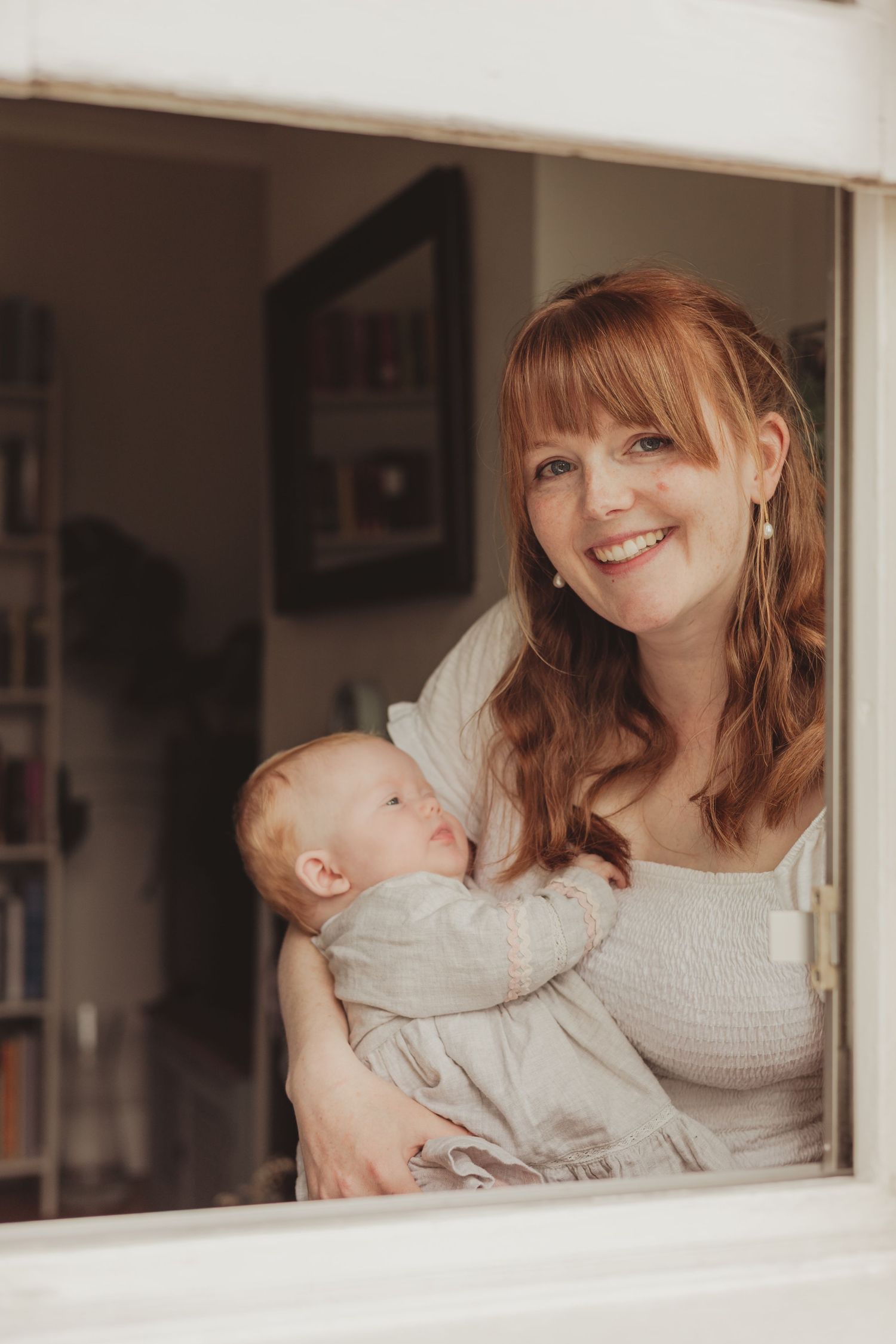 mum and baby through a window