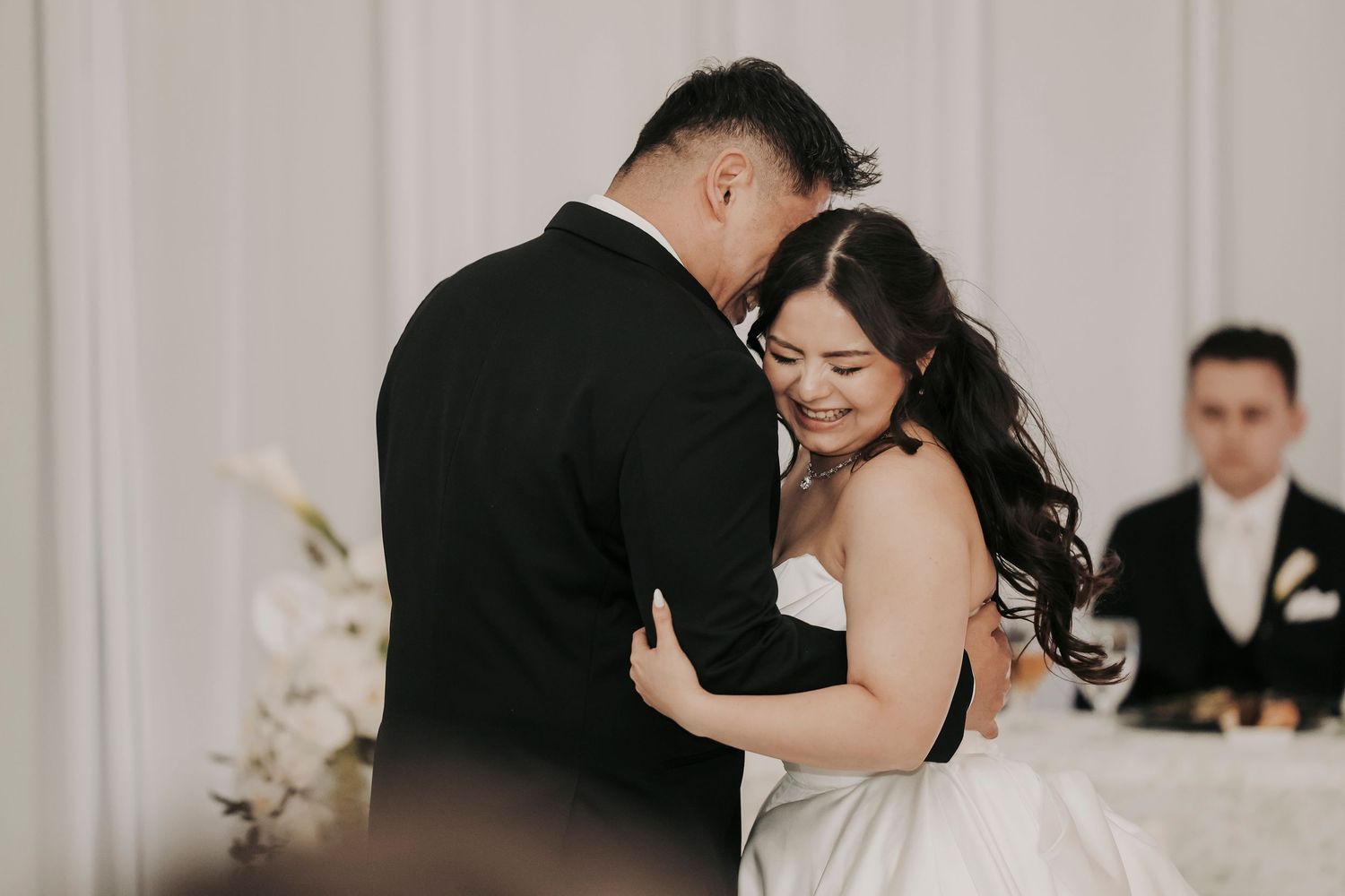 a bride dances with her dad at her wedding at brighton abbey