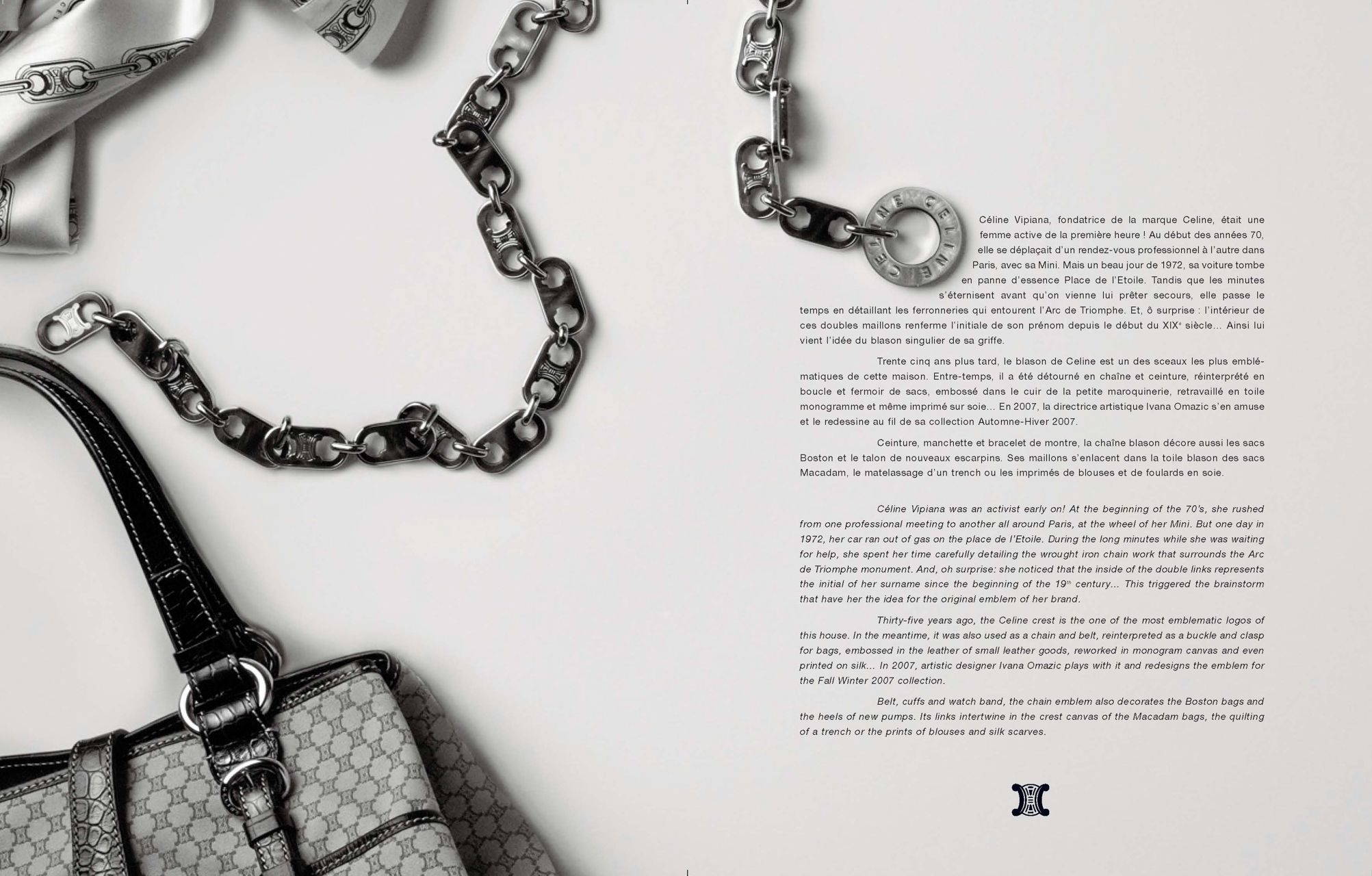 Luxury designer handbag with monogram pattern beside an elegant silver chain necklace on white background.