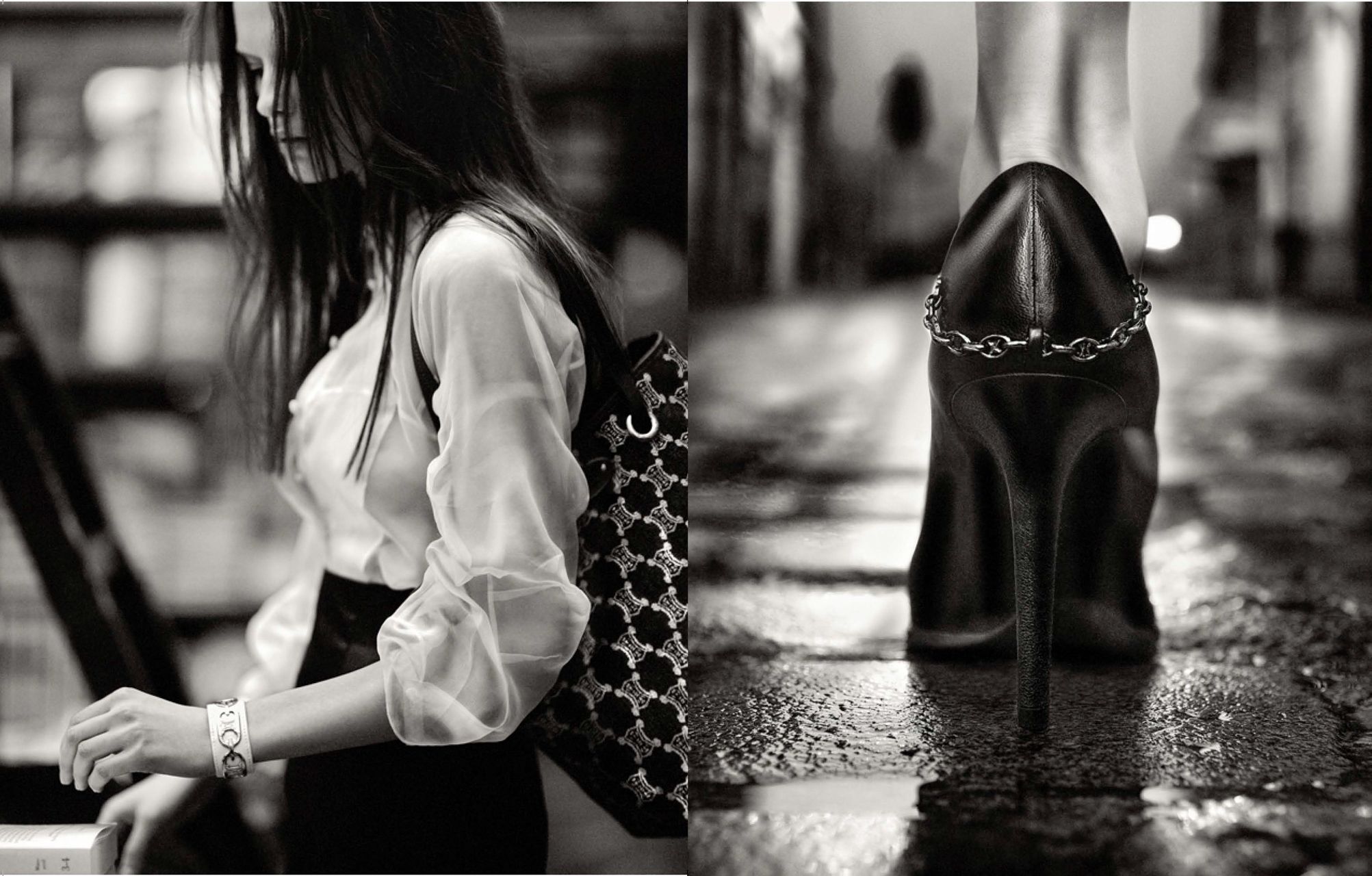 Black and white photo of a woman in white blouse holding studded bag beside a black stiletto heel with chain detail.
