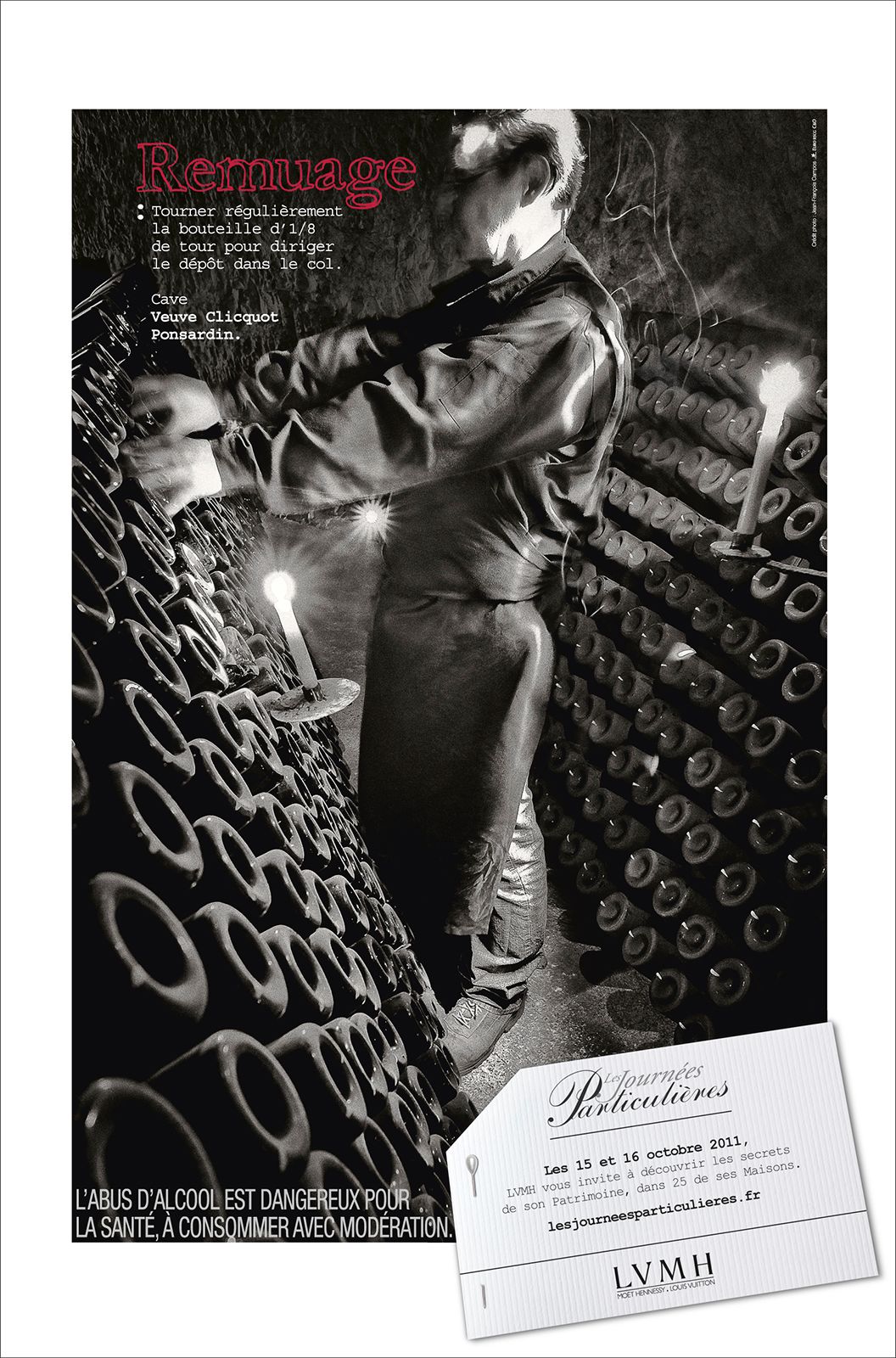 Black and white vintage champagne advertisement showing a cellar worker performing remuage, rotating bottles in a riddling rack.