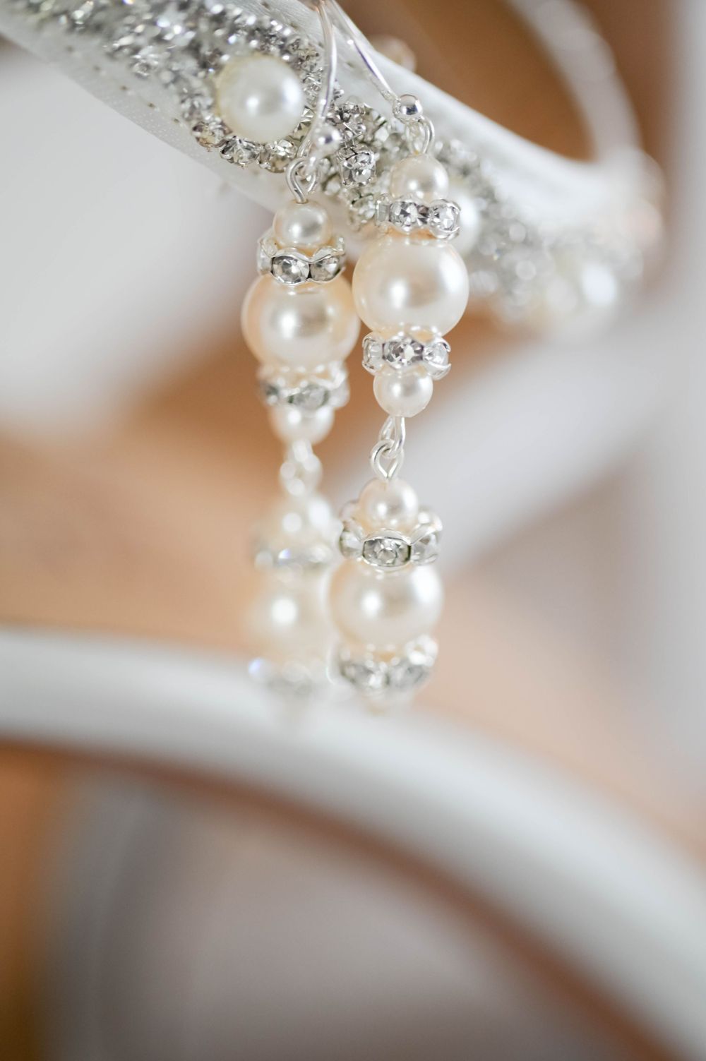 Elegant pearl and crystal bridal jewelry earrings with intricate detailing.
