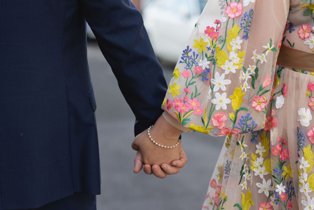 Couple holding hands
