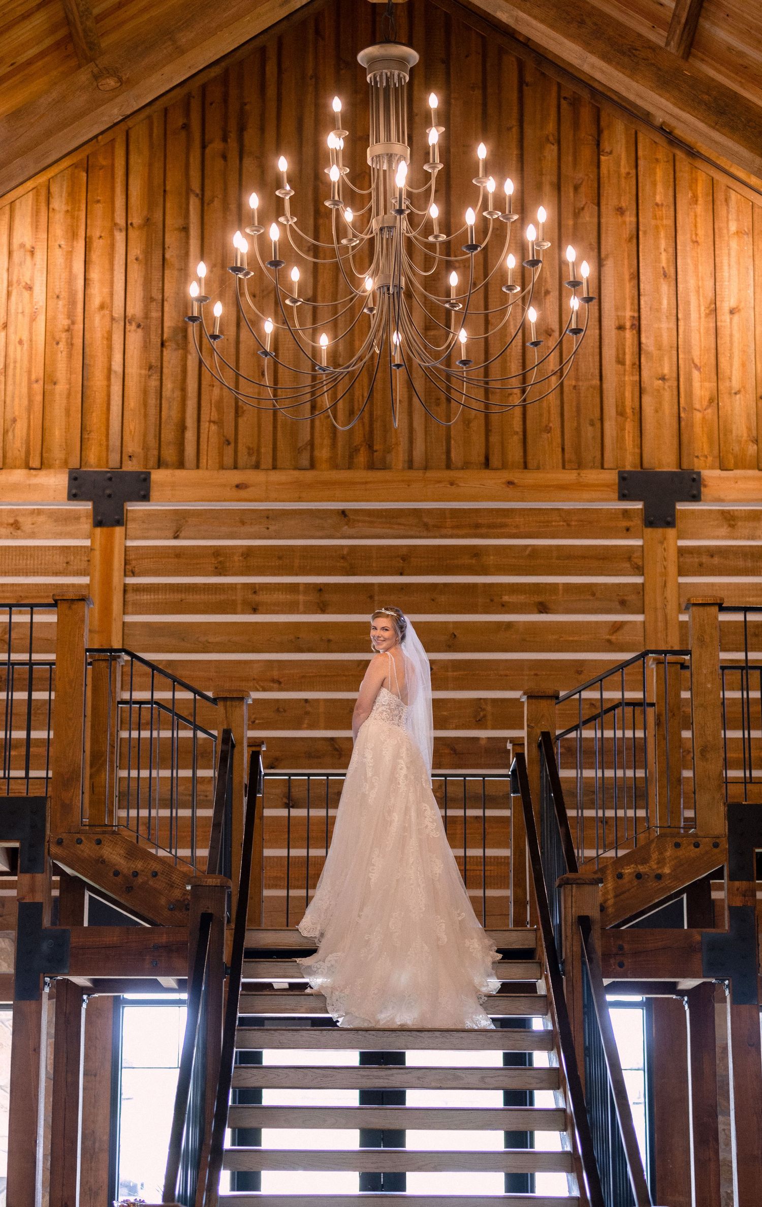 Bride looking back from the top of the stairs.