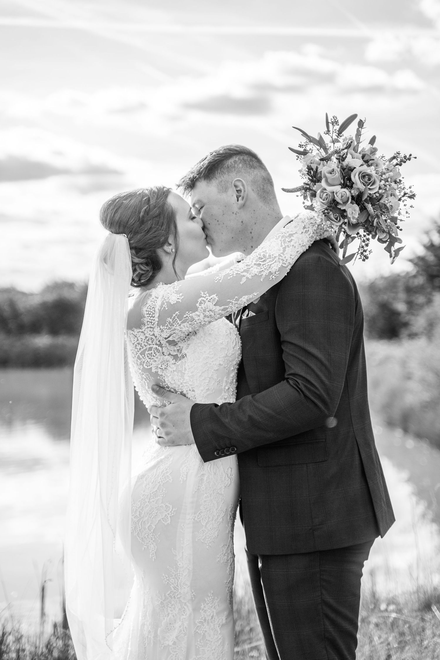 bride and groom kissing during wedding photos  at The Mill at Hoveringham wedding photography