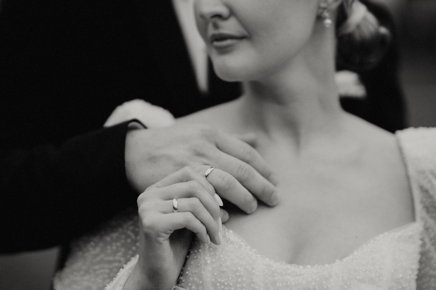 Elegant bridal details captured in black and white photography.