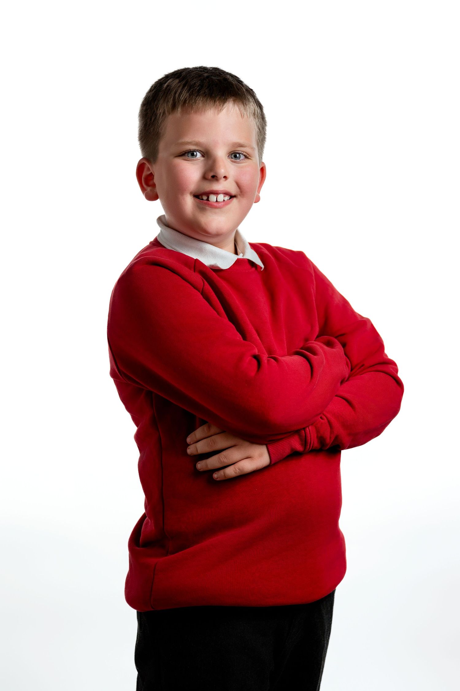 A series of four poses showing a child in a bright red sweatshirt with their arms crossed against a white background.