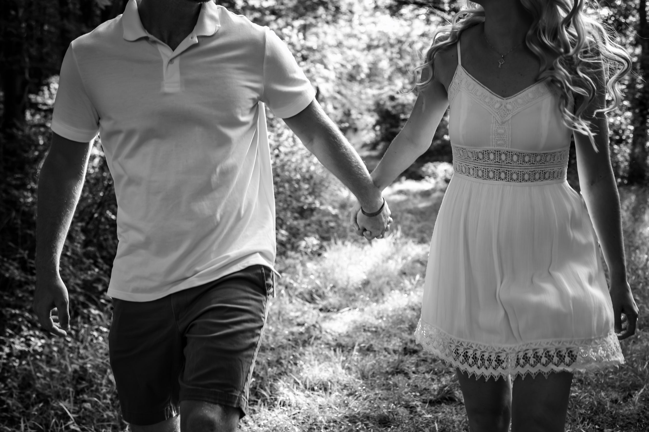 Black and white artistic shots capturing movement and connection during outdoor photo session.