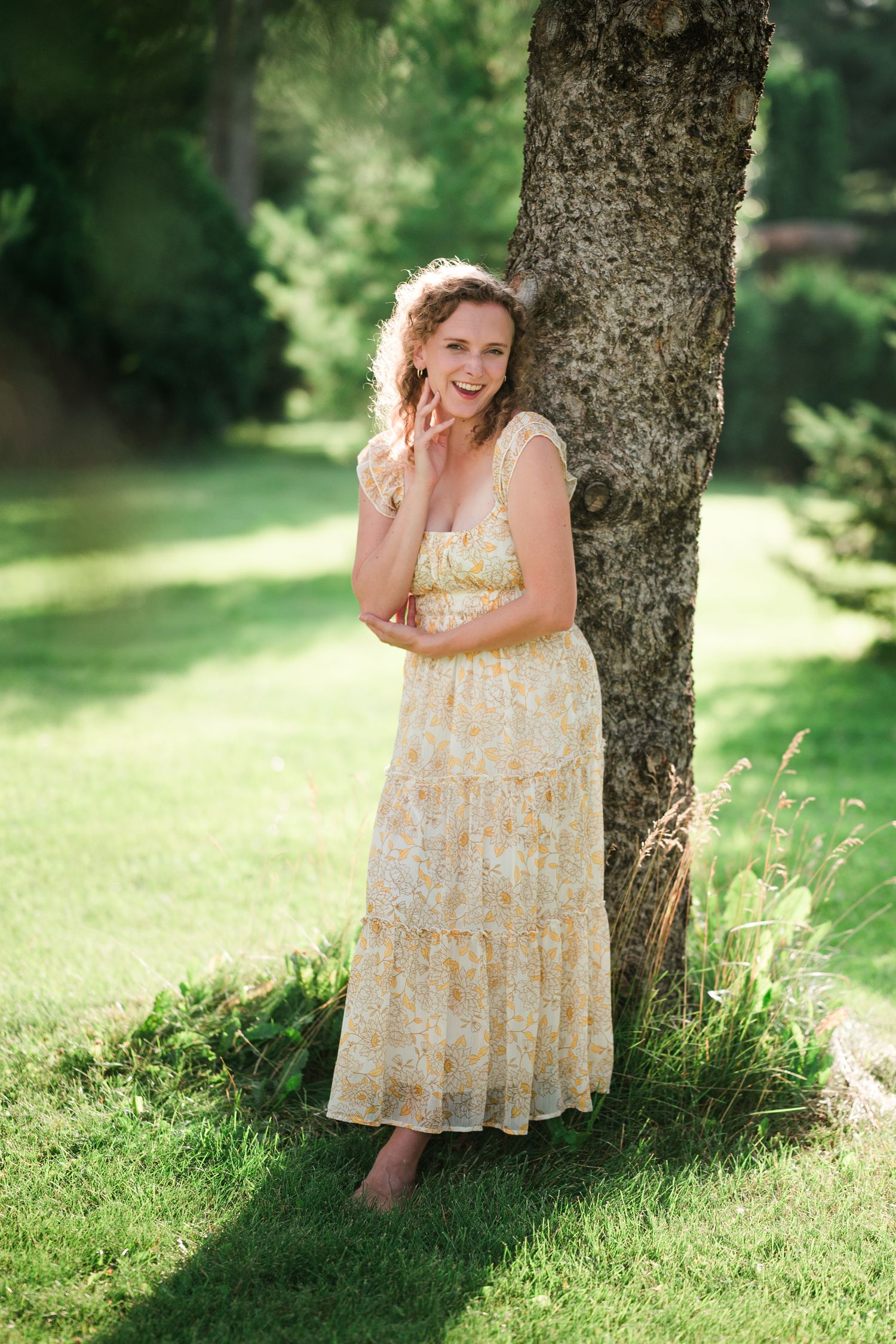 Softly lit portrait under a tree at Arneson Acres of Emmy, a wedding and portrait photographer in Minnesota