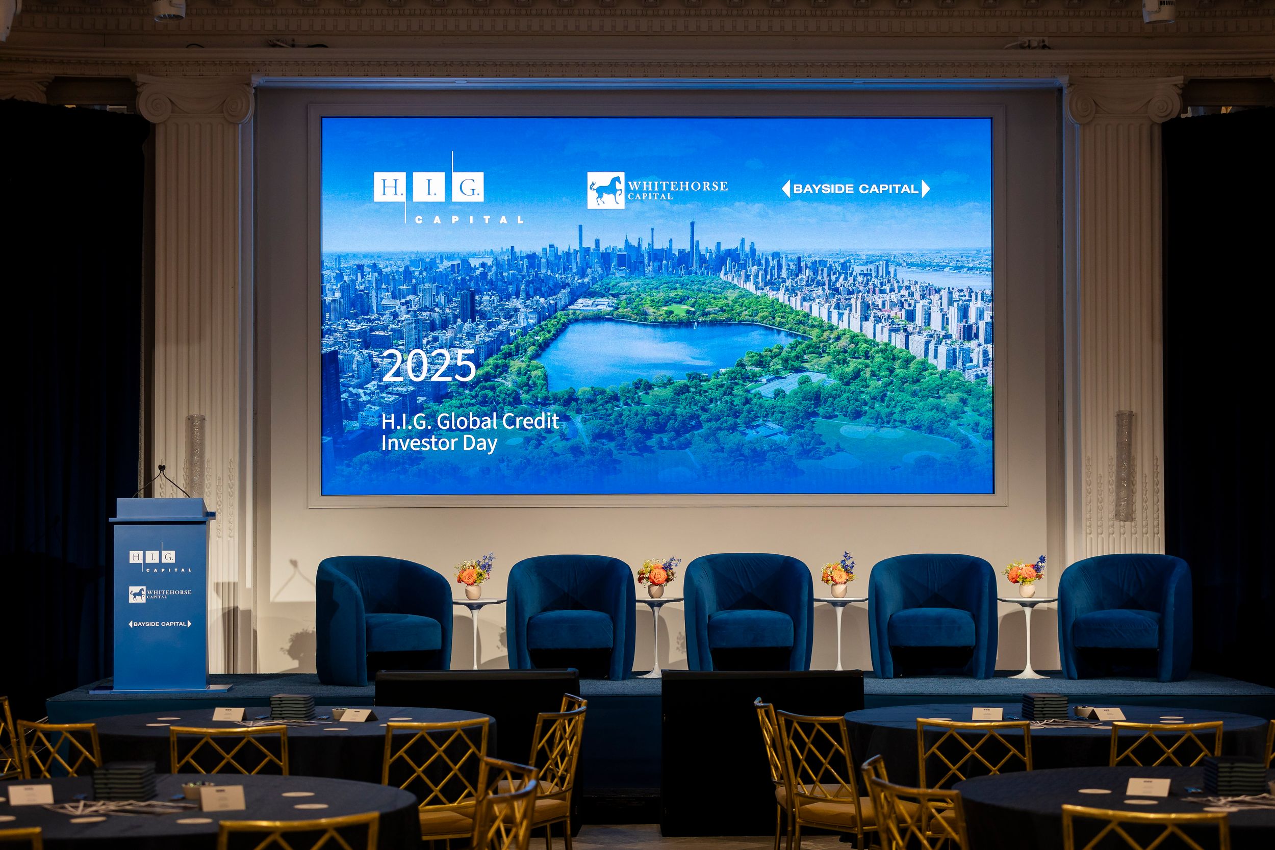 Wide conference room with presentation screen showing city skyline and harbor view.