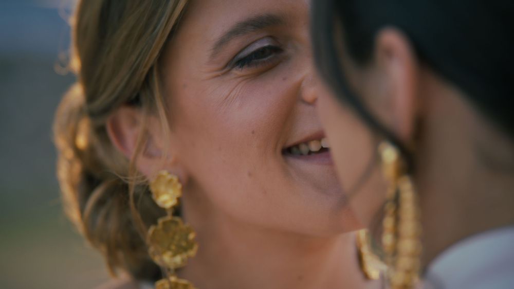Person with elaborate ornate gold earrings and evening makeup in a series of close-up profile portraits.